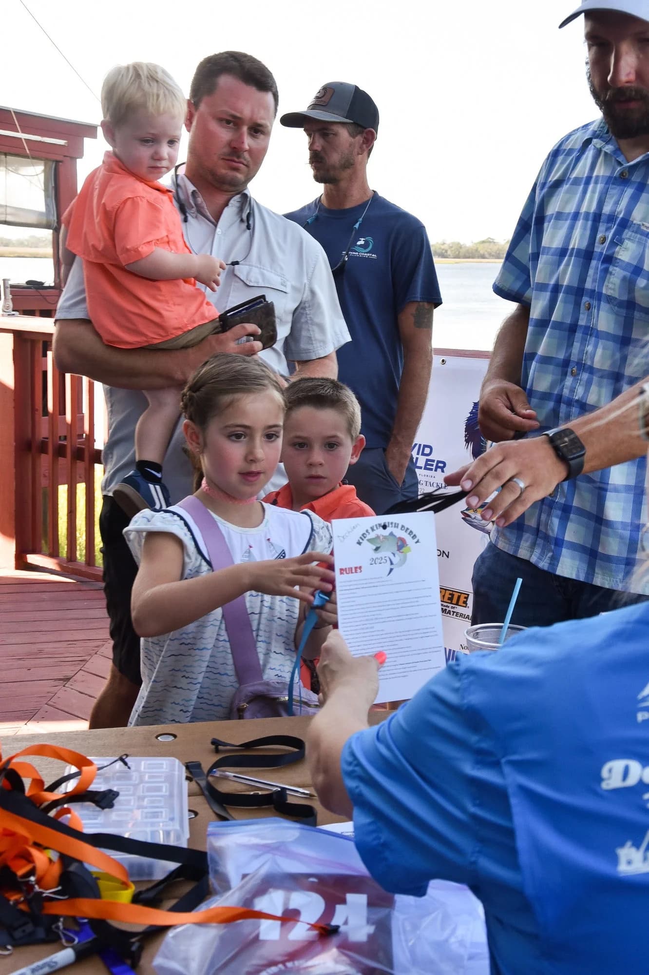Families checking in at the Kids Kingfish Derby registration table